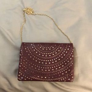 Maroon and gold crossbody clutch